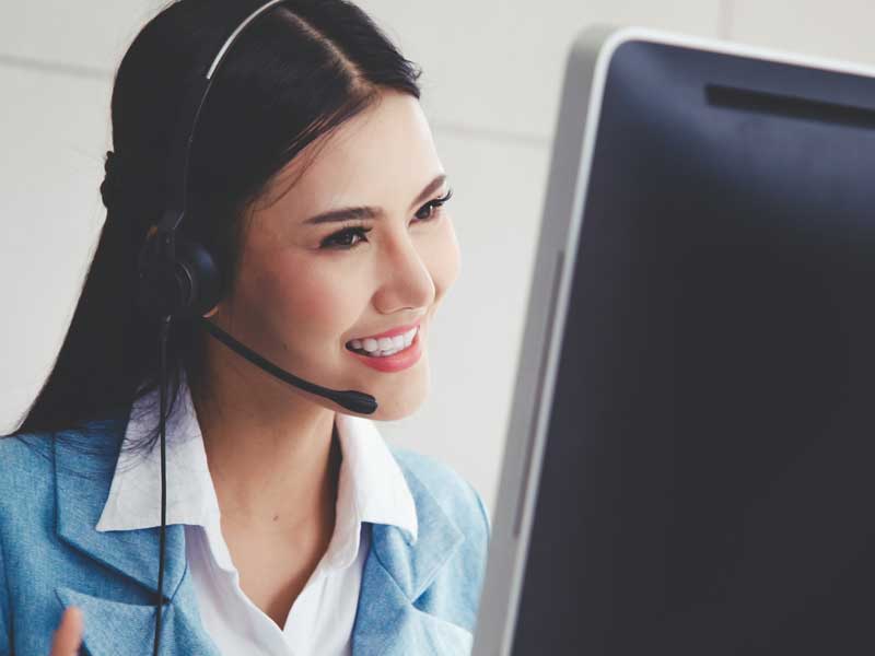 a insurance service personnel assisting a client through a telephone call